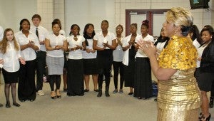 ‘LIFT EVERY VOICE AND SING’: Chynna Bonner, SHS Black History Month committee chairwoman, leads students in song before the Black History Month celebration. JONATHAN ROWE | DAILY NEWS 
