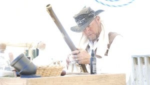 JONATHAN ROWE | CONTRIBUTED ARSENAL: Captain Nitrate, a Beaufort pirate, showcased his expertise in black powder weapons at Saturday’s Pirates on the Pungo in Belhaven. Nitrate explained each weapons function and purpose as well as maintenance for the weapons. Pictured is Nitrate cleaning his blunderbuss, a precursor to the modern day shotgun. He also took the time to polish his newest dagger, which was made and given to him by Captain Morgan himself. Nitrate’s encampment displayed a treasure chest, several different pistols, daggers, one of which was made from a bill of a swordfish and different types of cannons and mortars. 