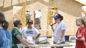 JONATHAN ROWE | DAILY NEWS PLANS: Volunteers with United Methodist Disaster Recovery discuss plans to continue construction at a Chocowinity property. Pictured are Tabernacle Methodist Church volunteers and members Mary Hall, Nathan Brunelle, Carter Moore and Bella Coulter. 
