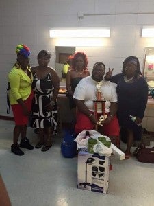 BRANDY YOUNG CREATING SMILES: Quentin Hill, pictured with Beaufort County women that served as models for a recent hair show in Georgia, recently won first overall at Brandy “Lady B” Young’s inaugural Beyond the Chair Show in Swainsboro, Ga. 