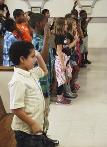 CAROLINE HUDSON | DAILY NEWS TAKING AN OATH: Members of the third-grade jury from Chocowinity Primary take an oath to be fair jurors and uphold the law in the courtroom. 