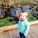 Even toddlers, like little Emelia, enjoy an adventurous hike down the boardwalk. Her and her mother Brandi often visit the park to explore the sights and sounds, like these cypress trees. 